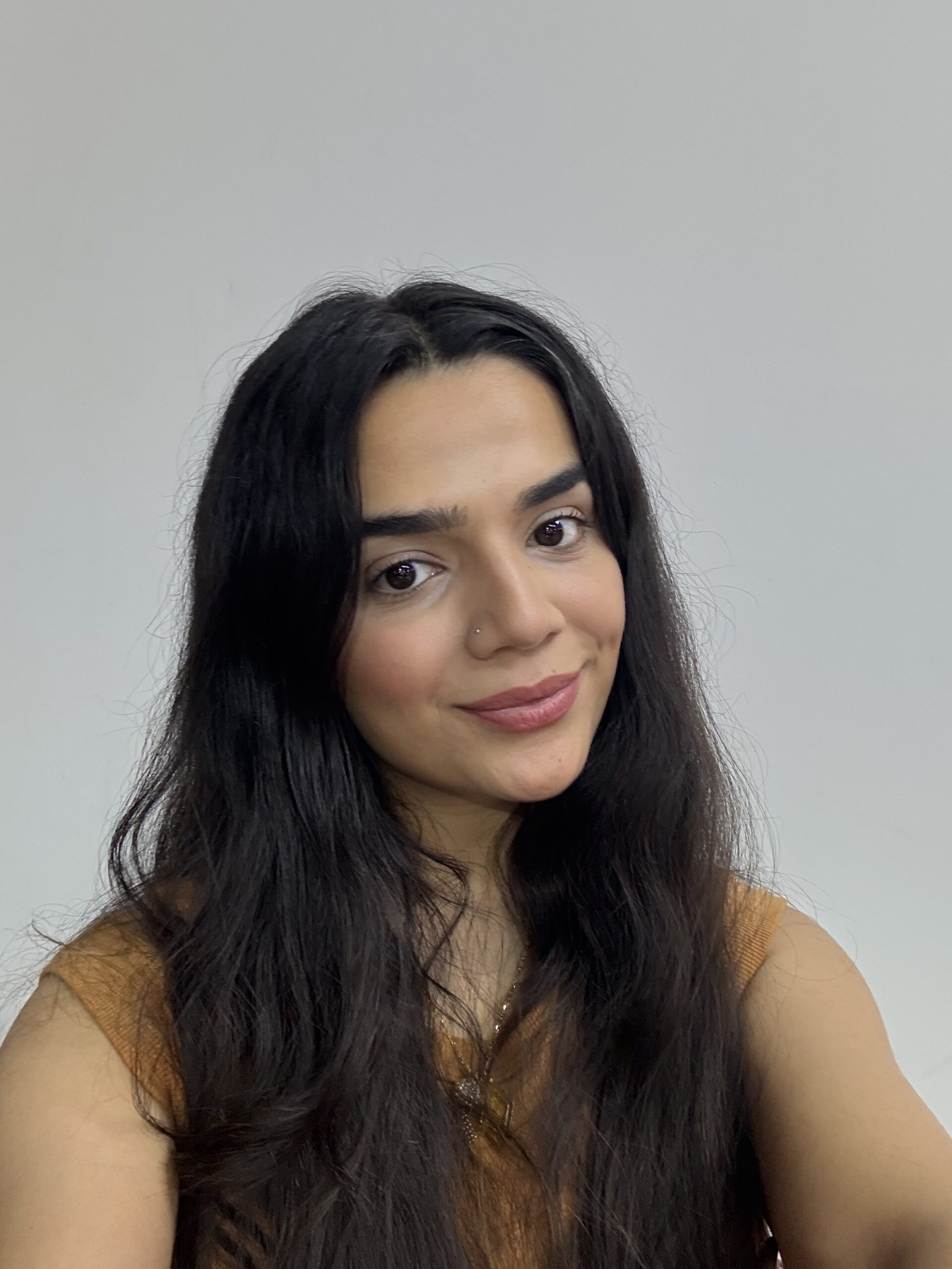 Close-up of blush applied on cheek showing natural finish and texture for different skin types including oily, dry and combination skin