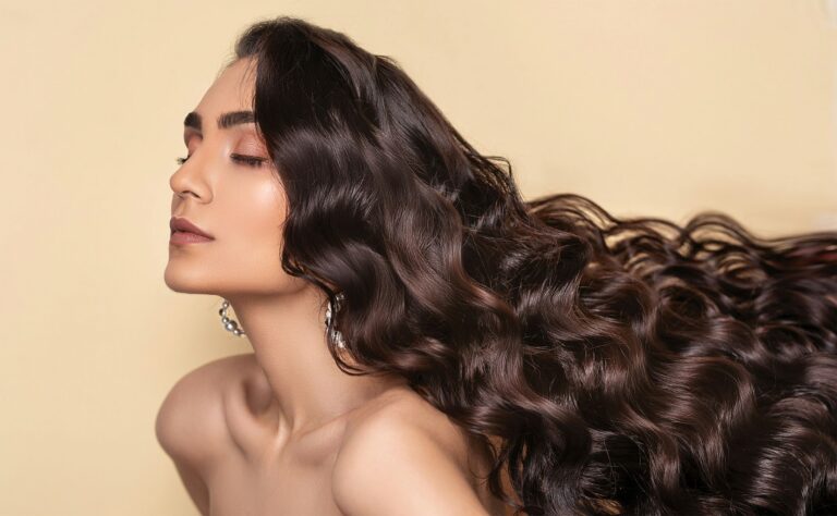 Woman with long, healthy hair, illustrating how to grow your hair faster
